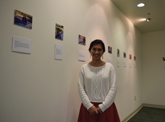 Cleveland State Art student Bianca Dedicatoria completed her first solo art exhibition titled “Cultural Diversity in America, 2016.” Pictured: Dedicatoria stands in front of her exhibition located in CSCC’s George R. Johnson Cultural Heritage Center.  