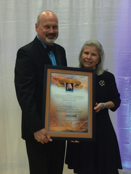 Dr. Bill Seymour presents Brenda Hughes with the Community First Person of the Year Award at Thursday’s gala.